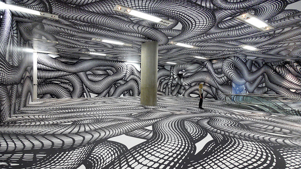 Este artista convierte paredes planas en vórtices en remolinos que sorprenderán a tu cerebro
