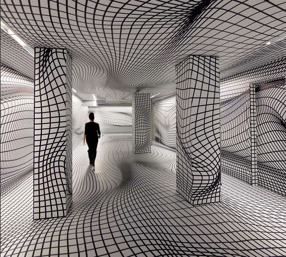 Este artista convierte paredes planas en vórtices en remolinos que sorprenderán a tu cerebro